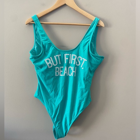 Women’s One Piece NWOT Teal Blue Green Humour “But First, Beach” Swim Suit - Picture 1 of 3